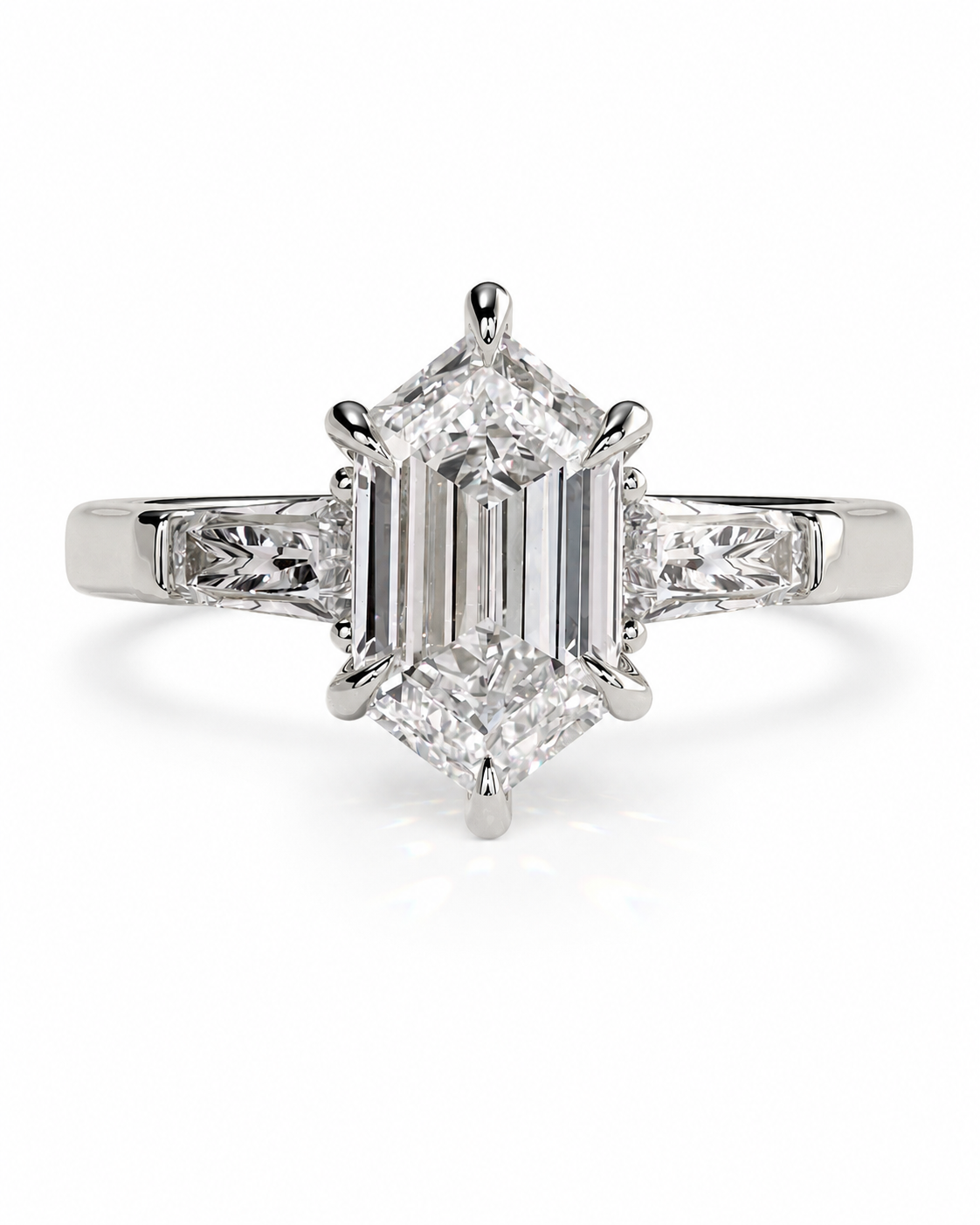 color_925_SIL,color_935_ARG,color_10K_WG, color_14K_WG &&An emerald-cut diamond engagement ring with a silver-toned band and baguette side stones, shown on a clean white background.