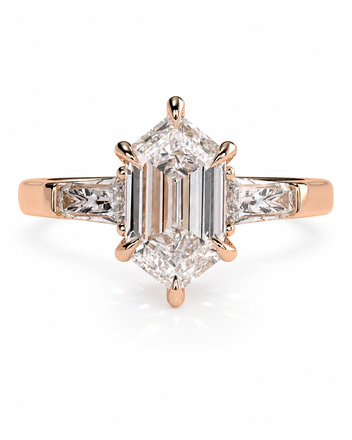 color_10K_RG, color_14K_RG &&A rose gold ring featuring a large emerald-cut diamond center stone with baguette and round-cut diamond side stones, set in a four-prong setting on a white background.