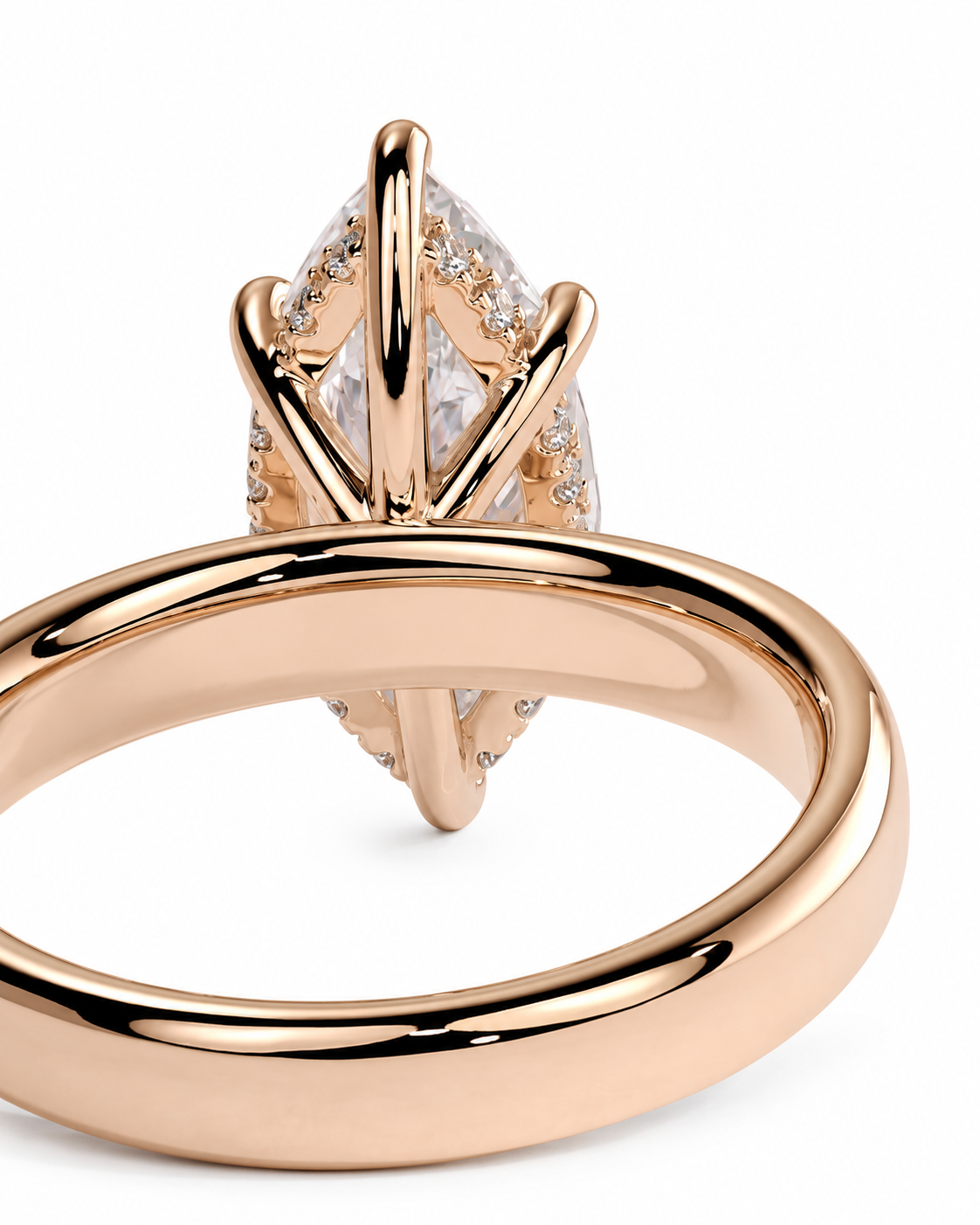 color_10K_RG, color_14K_RG &&Rose gold ring with a marquise-cut clear gemstone in a prong setting, shown on a clean white background.