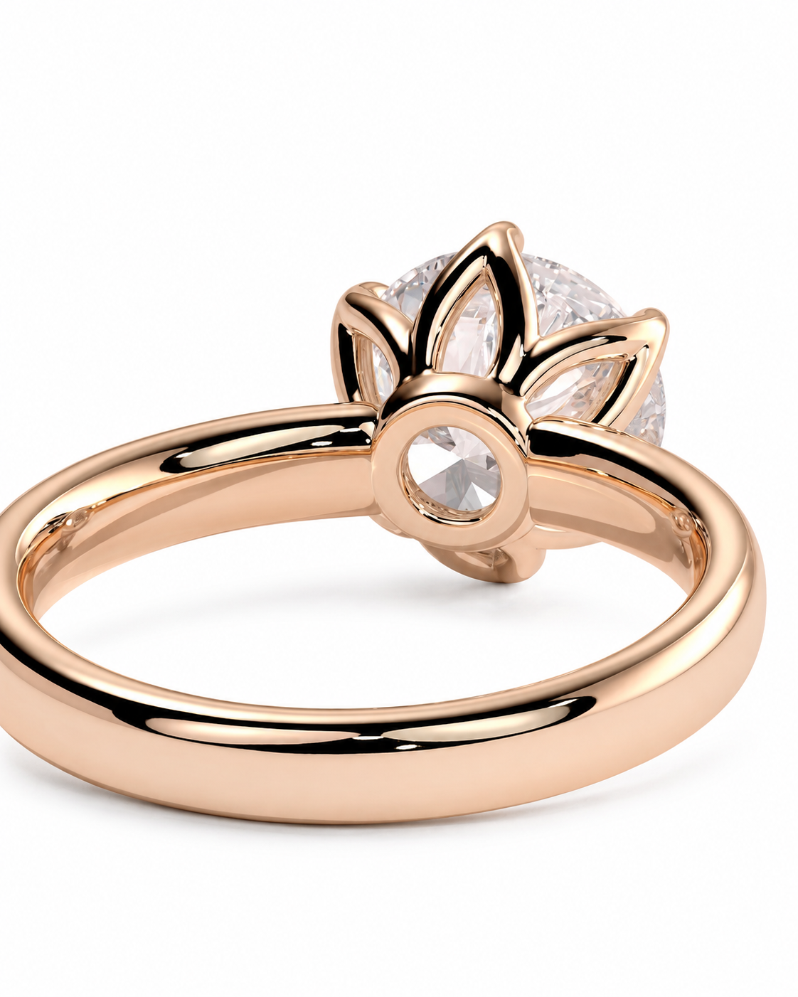 color_10K_RG, color_14K_RG &&A close-up shot of a rose gold ring with a lotus flower setting and clear gemstones, shown on a plain white background.