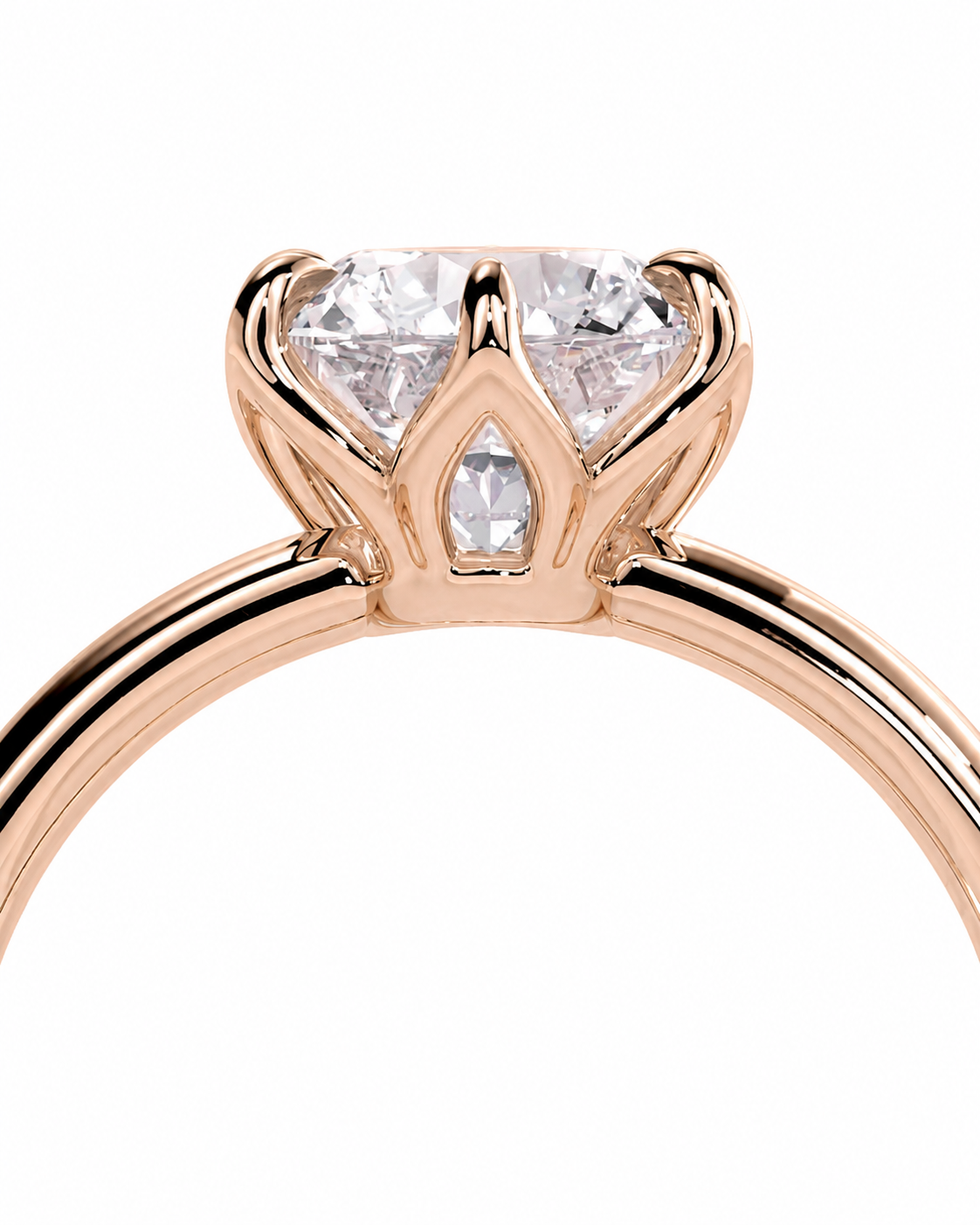 color_10K_RG, color_14K_RG &&A close-up of a rose gold ring with a brilliant round-cut diamond and a smaller center stone, set in a crown-like prong design on a white background.