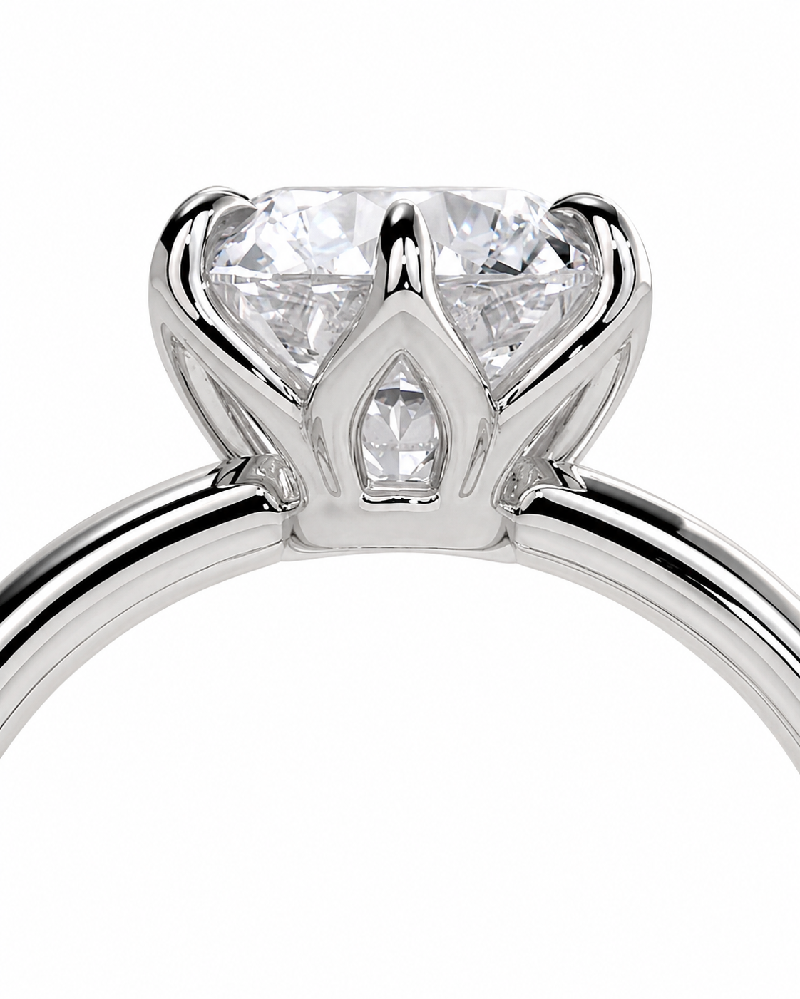 color_925_SIL,color_935_ARG,color_10K_WG, color_14K_WG &&A close-up studio shot of a silver-tone crown solitaire ring with a clear heart-shaped diamond and a marquise-cut diamond accent, set against a solid white background.