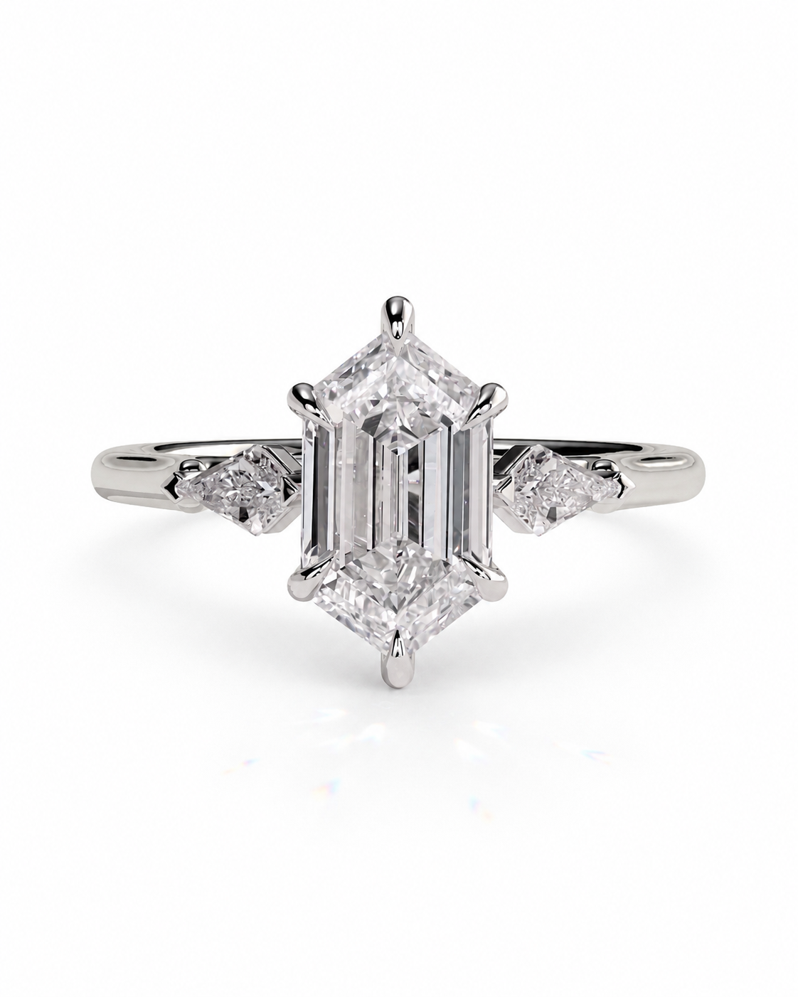 color_925_SIL,color_935_ARG,color_10K_WG, color_14K_WG &&An emerald-cut diamond engagement ring with a silver-toned band and small side diamonds, centered on a white background.