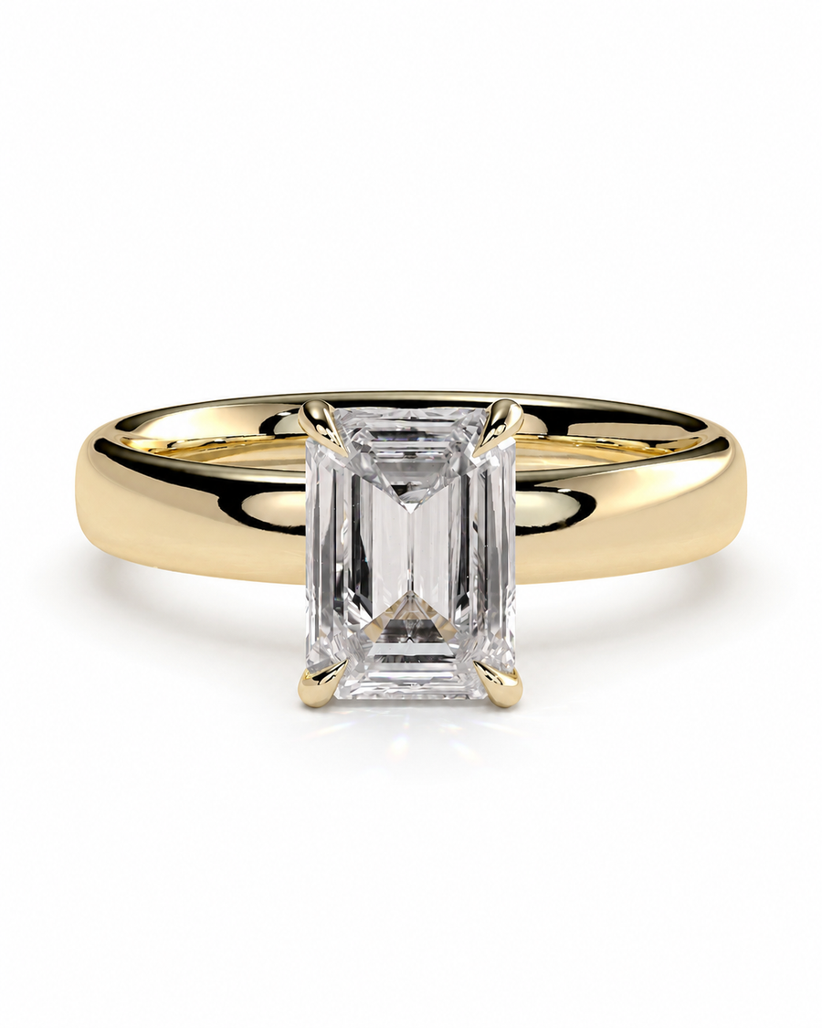 color_10K_YG, color_14K_YG &&A yellow gold ring with a large emerald-cut clear center stone, photographed on a clean white background.