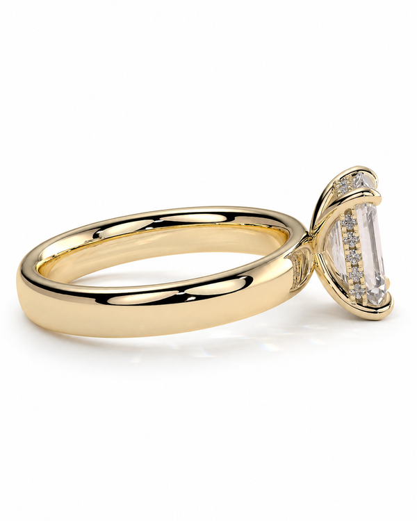 color_10K_YG, color_14K_YG &&A yellow gold ring with a large marquise-cut clear gemstone in a prong setting, accented with small round diamonds along the side, shown on a clean white background.