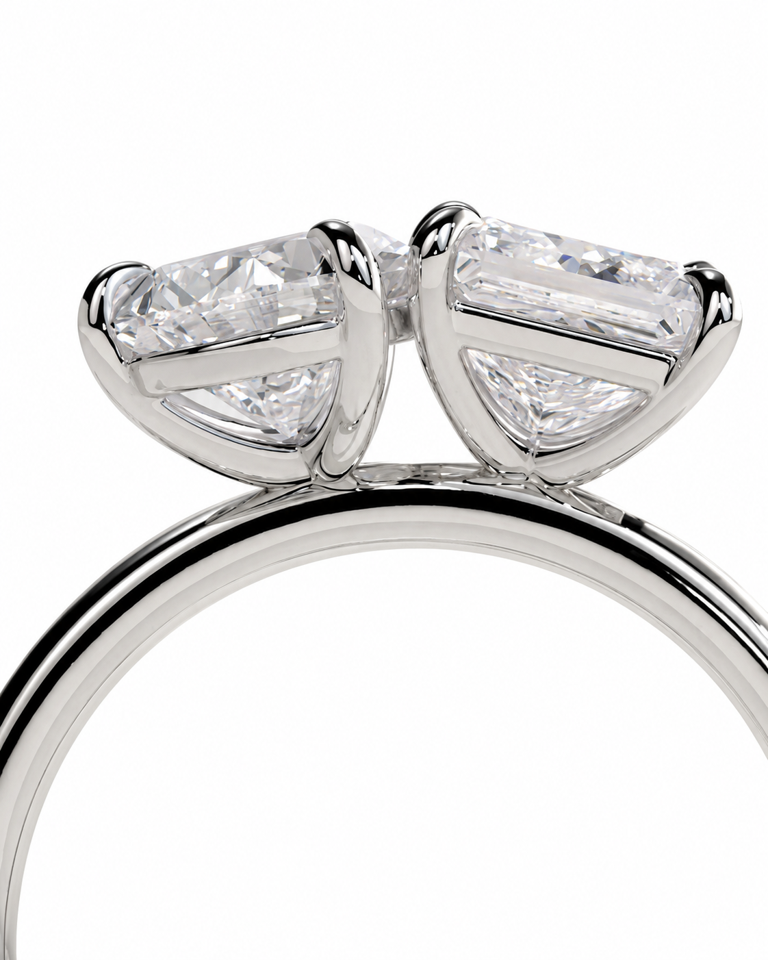 color_925_SIL,color_935_ARG,color_10K_WG, color_14K_WG && close-up of a silver-toned ring featuring two marquise-cut clear gemstones in a bow-like setting, shown against a plain white background.