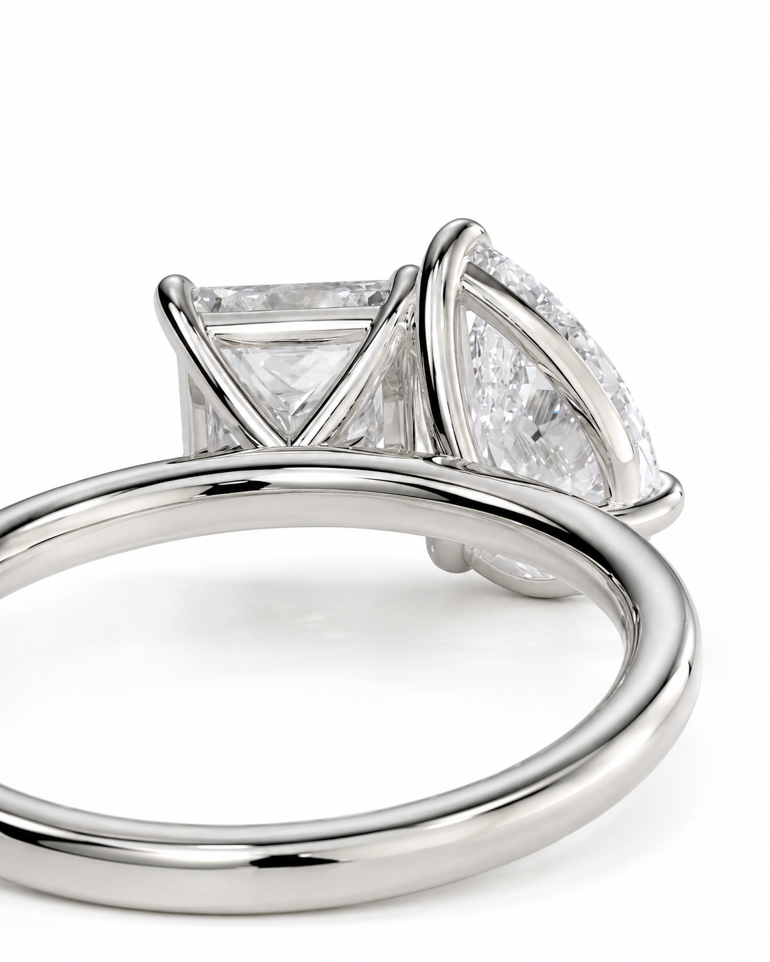 color_925_SIL,color_935_ARG,color_10K_WG, color_14K_WG && close-up studio shot of a silver-toned ring featuring a large triangular clear gemstone in a three-stone setting, with smaller accent stones along the side, on a white background.