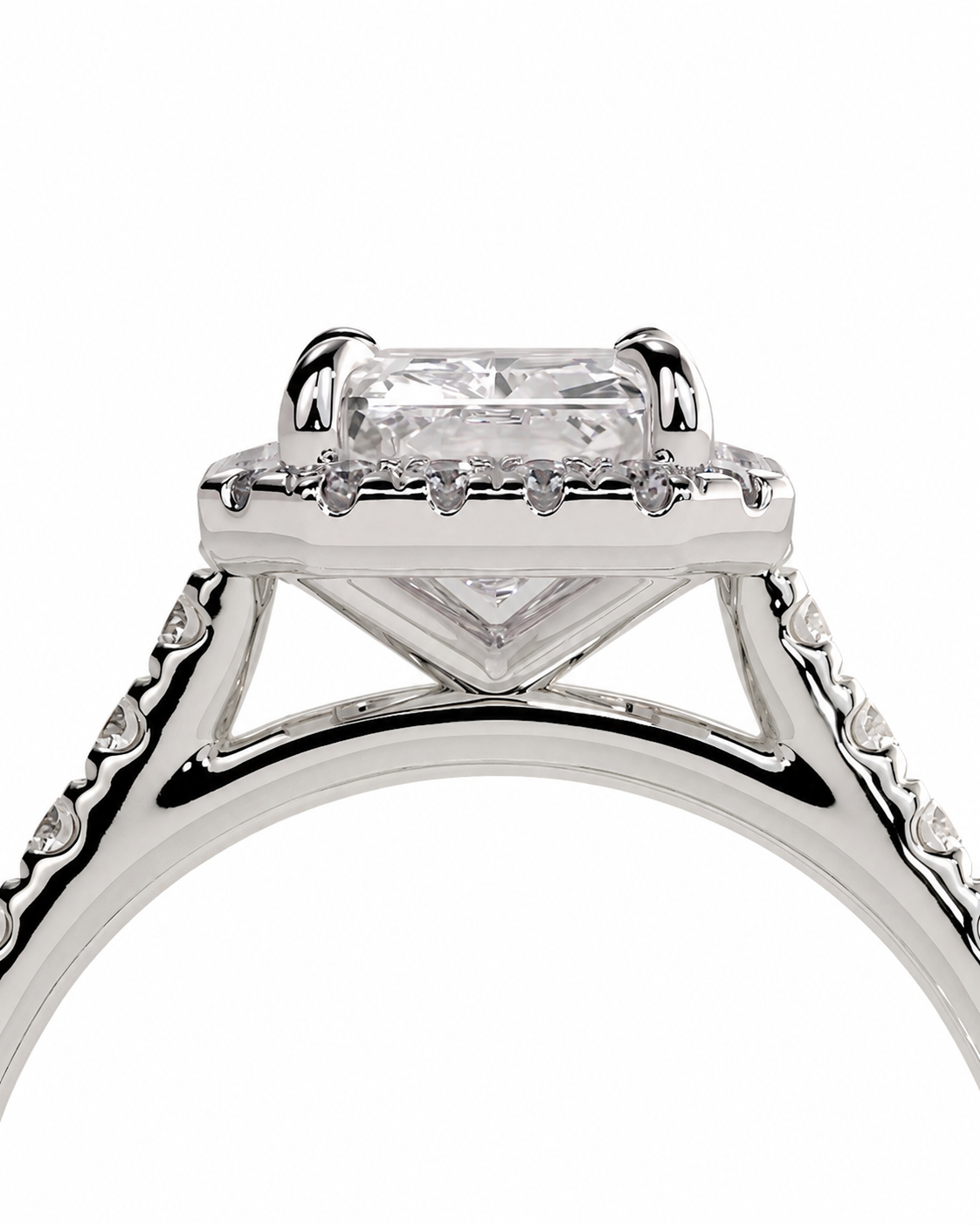 color_925_SIL,color_935_ARG,color_10K_WG, color_14K_WG &&Close-up of a silver-toned ring with a rectangular clear gemstone in a prong setting, surrounded by small accent stones on a white background.