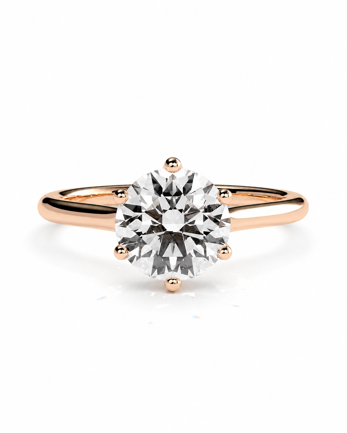 color_10K_RG, color_14K_RG &&A classic solitaire engagement ring featuring a round brilliant-cut diamond set in a rose gold four-prong setting on a polished band, shown against a clean white background.