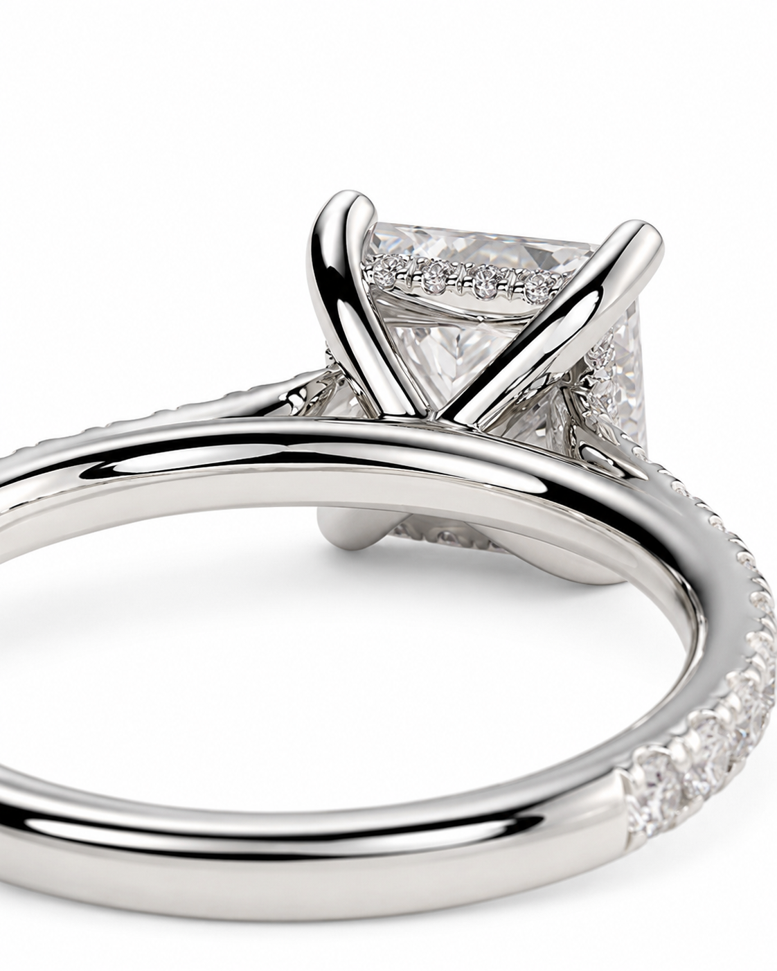 color_925_SIL,color_935_ARG,color_10K_WG, color_14K_WG &&A close-up studio shot of a silver-toned diamond ring featuring a square-cut center stone in a prong setting with a split shank and pavé accents on a white background.