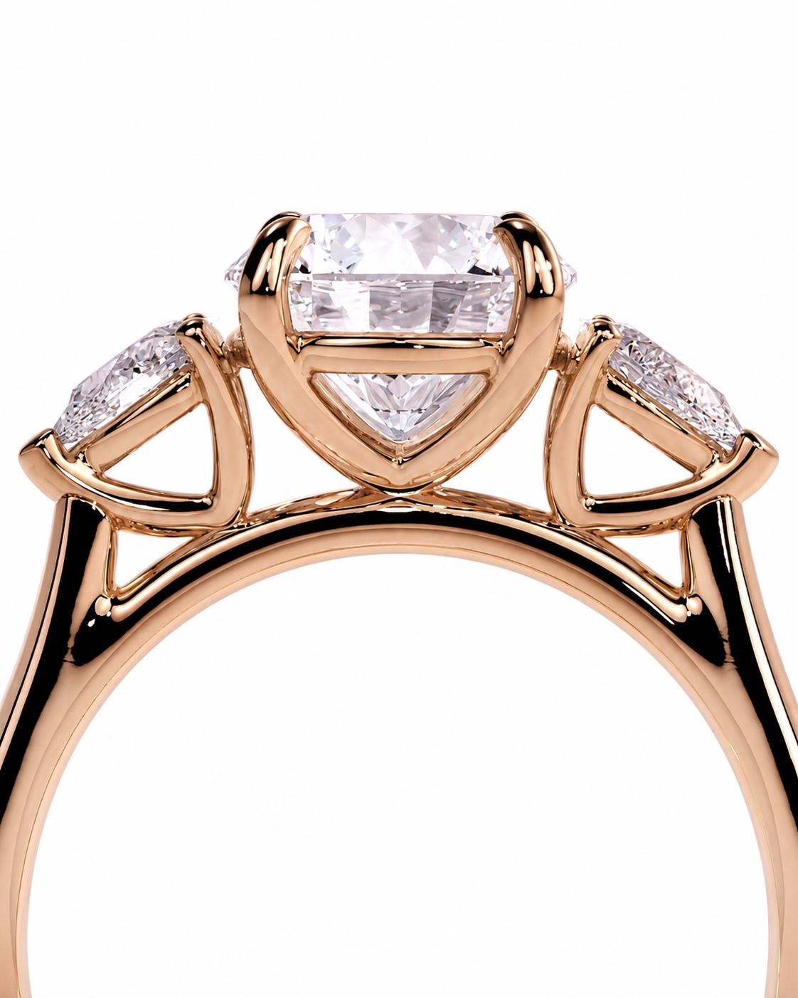 color_10K_RG, color_14K_RG &&Rose gold ring with a large rectangular center stone and two smaller marquise-cut side stones, shown in a close-up studio shot on a white background.