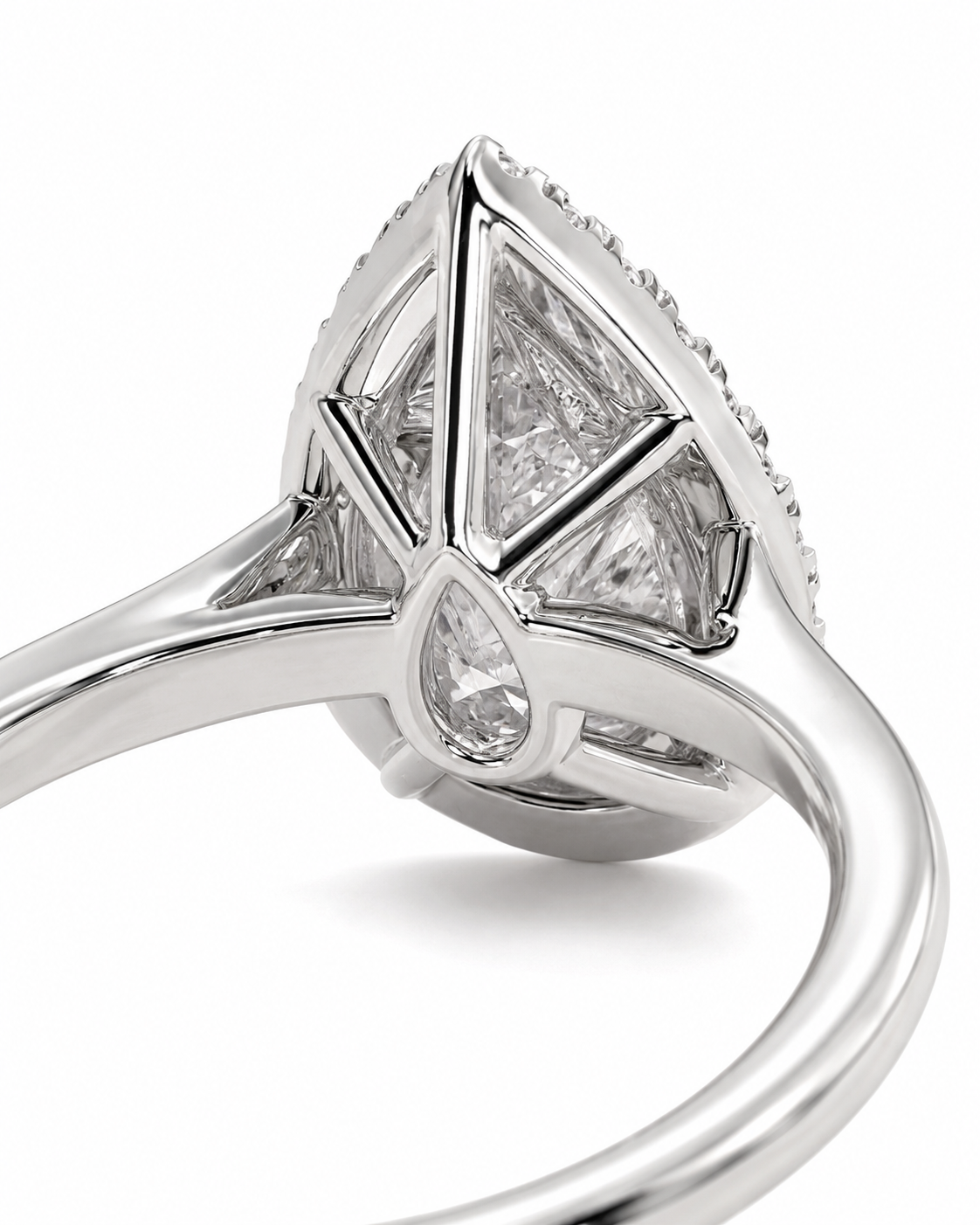 color_925_SIL,color_935_ARG,color_10K_WG, color_14K_WG &&A close-up studio shot of a silver-toned ring featuring a large triangular marquise-cut clear gemstone in a geometric setting, with smaller accent stones along the top and a teardrop-shaped stone on the band, set against a plain white background.