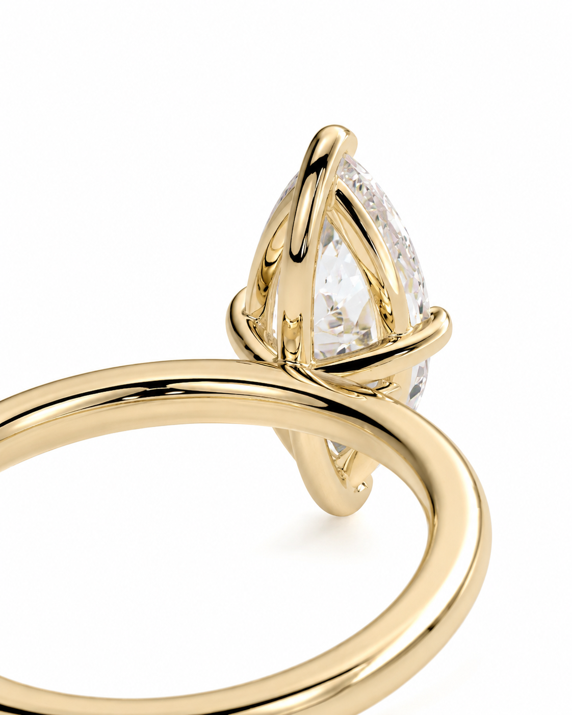 color_10K_YG, color_14K_YG &&A close-up of a gold ring featuring a marquise-cut clear gemstone in a wrap-style setting, shown against a plain white background.
