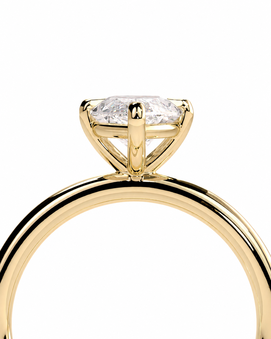 color_10K_YG, color_14K_YG &&A close-up shot of a yellow gold ring with a brilliant-cut clear gemstone in a four-prong setting, shown against a solid white background.