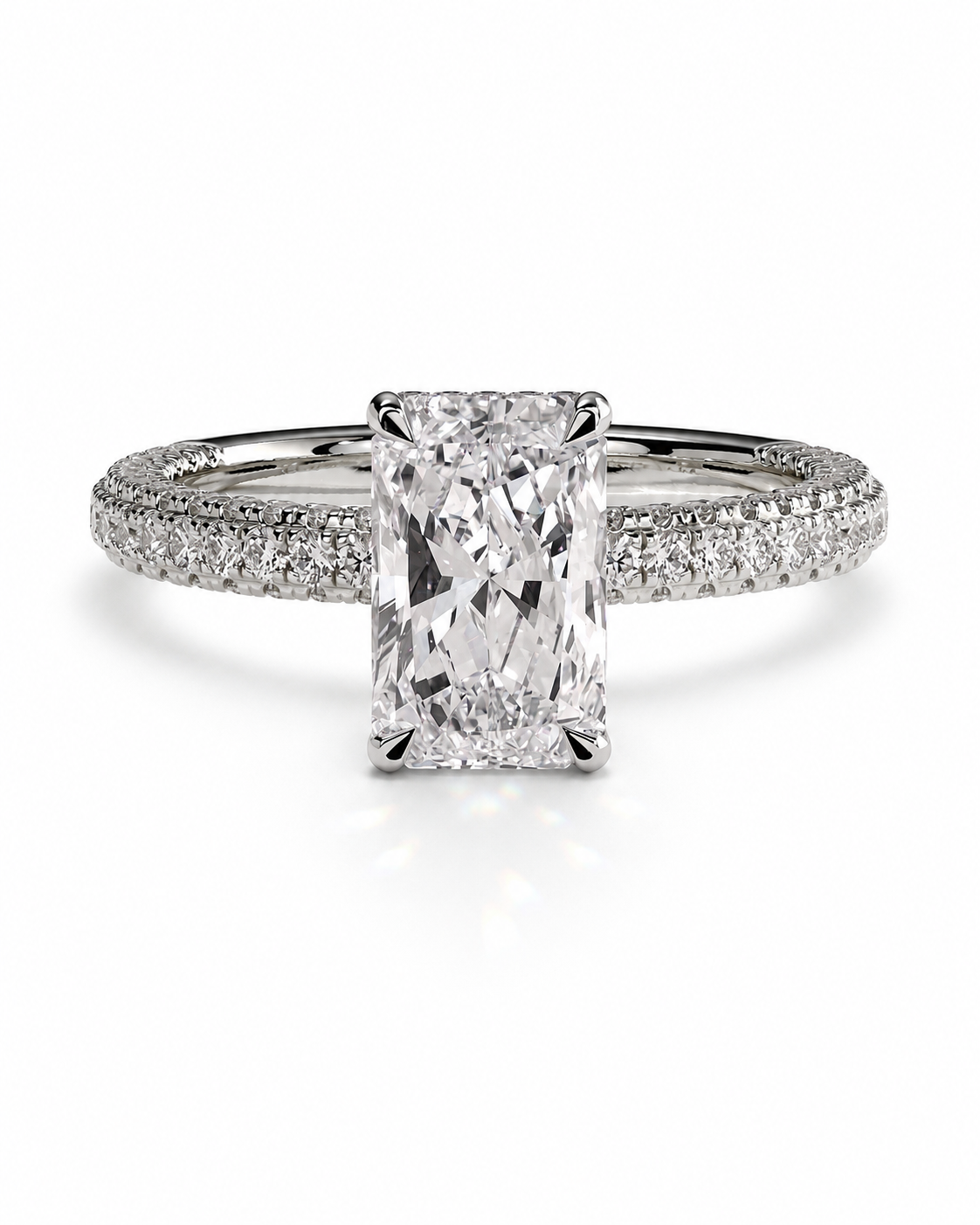 color_925_SIL,color_935_ARG,color_10K_WG, color_14K_WG &&An emerald-cut diamond engagement ring with a pavé band, shown on a clean white background.