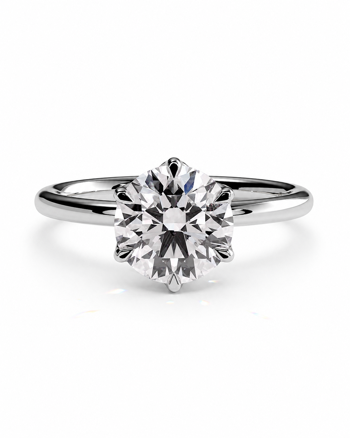 color_925_SIL,color_935_ARG,color_10K_WG, color_14K_WG &&A classic solitaire engagement ring featuring a round brilliant-cut diamond set in a polished silver-colored metal band, shown on a clean white background.