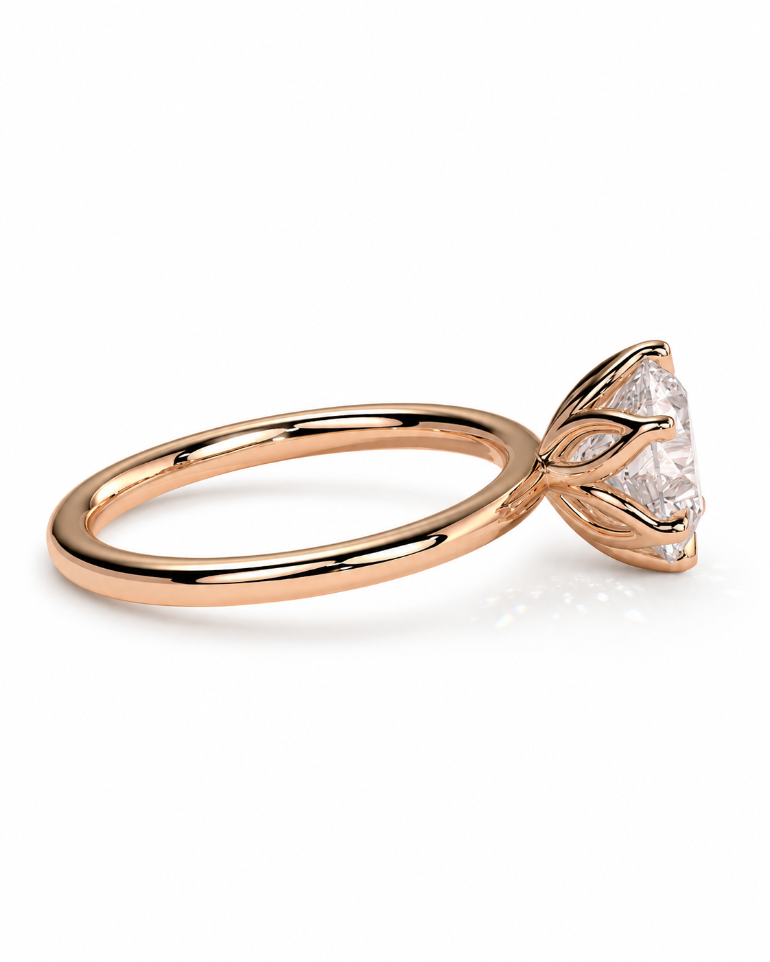 color_10K_RG, color_14K_RG &&A rose gold ring with a marquise-cut clear gemstone in a prong setting, shown on a clean white background.