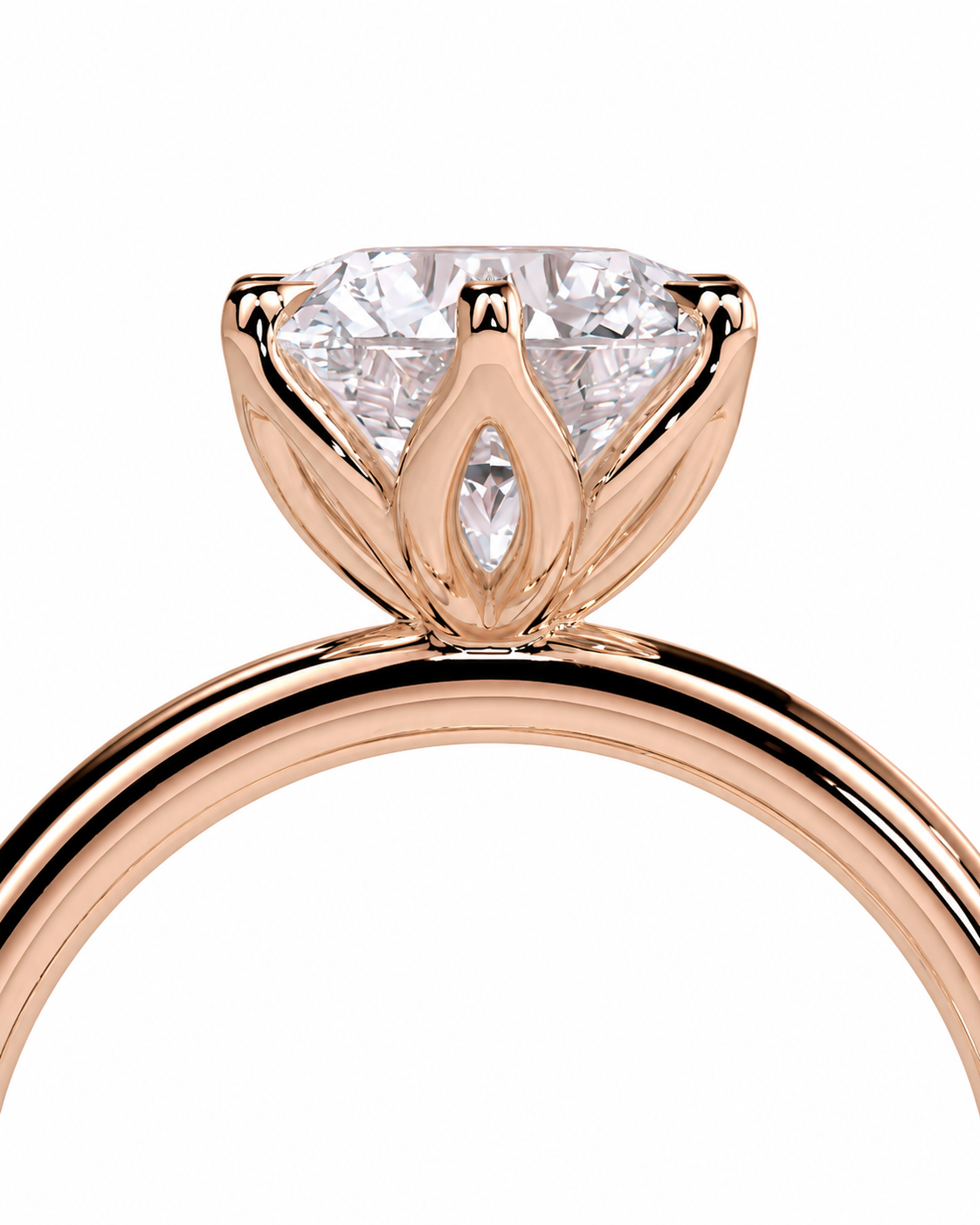 color_10K_RG, color_14K_RG &&A close-up of a rose gold ring featuring a marquise-cut diamond center stone in a prong setting, shown against a plain white background.