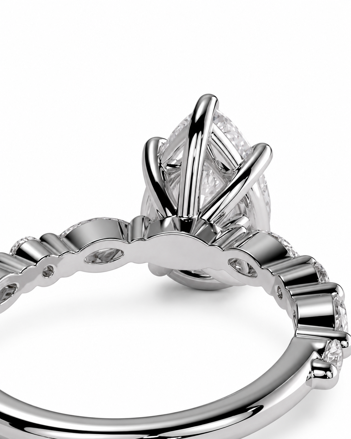 color_925_SIL,color_935_ARG,color_10K_WG, color_14K_WG &&Close-up of a silver-toned diamond ring with a large oval center stone in a prong setting and small round stones along the band, shown on a white background.