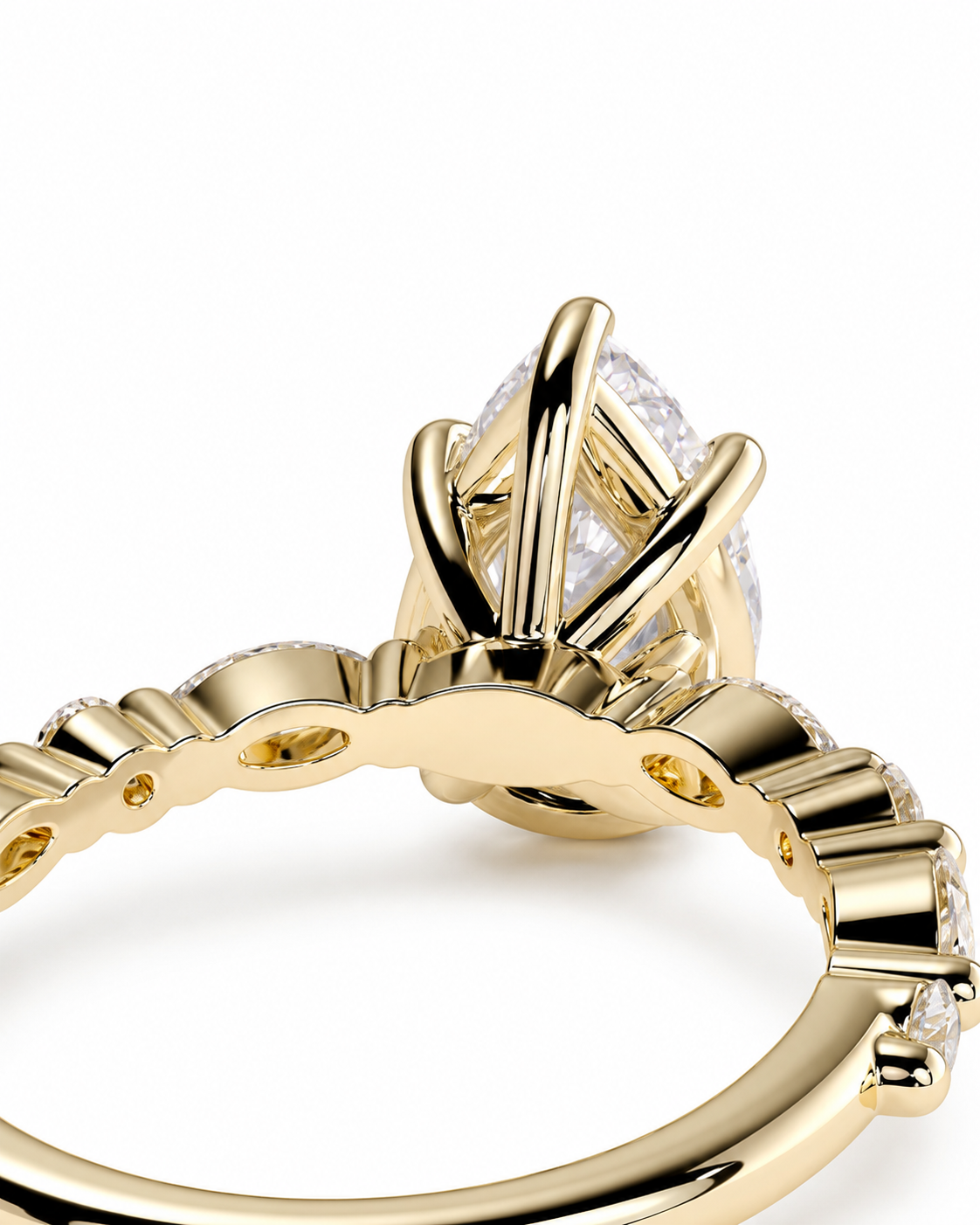 color_10K_YG, color_14K_YG &&Close-up of a yellow gold ring with a marquise-cut clear gemstone in a claw setting, shown on a white background.