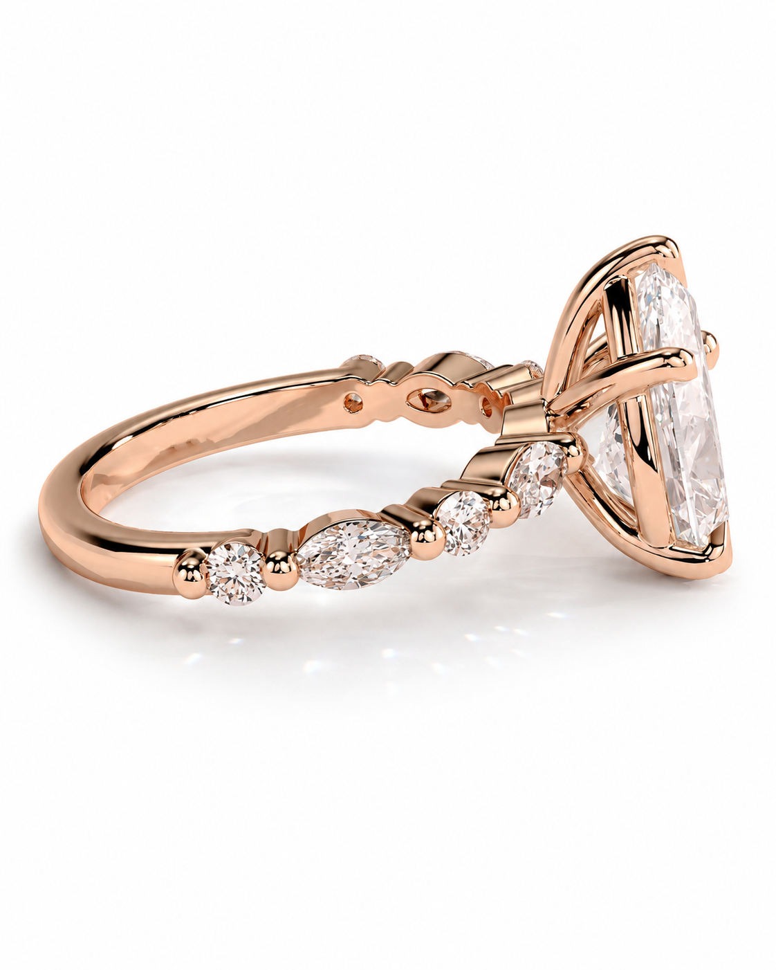 color_10K_RG, color_14K_RG &&Rose gold ring with a marquise-cut clear center stone and smaller round stones along the band, shown on a clean white background.