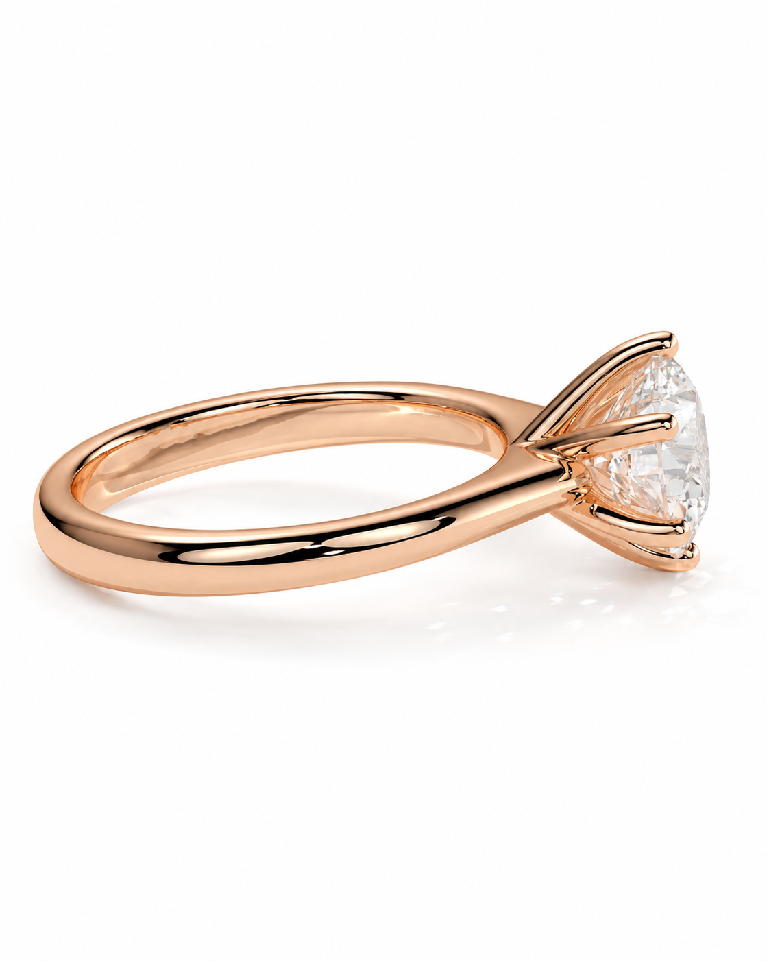 color_10K_RG, color_14K_RG &&A rose gold solitaire engagement ring with a triangular-cut clear gemstone in a prong setting, shown on a clean white background.