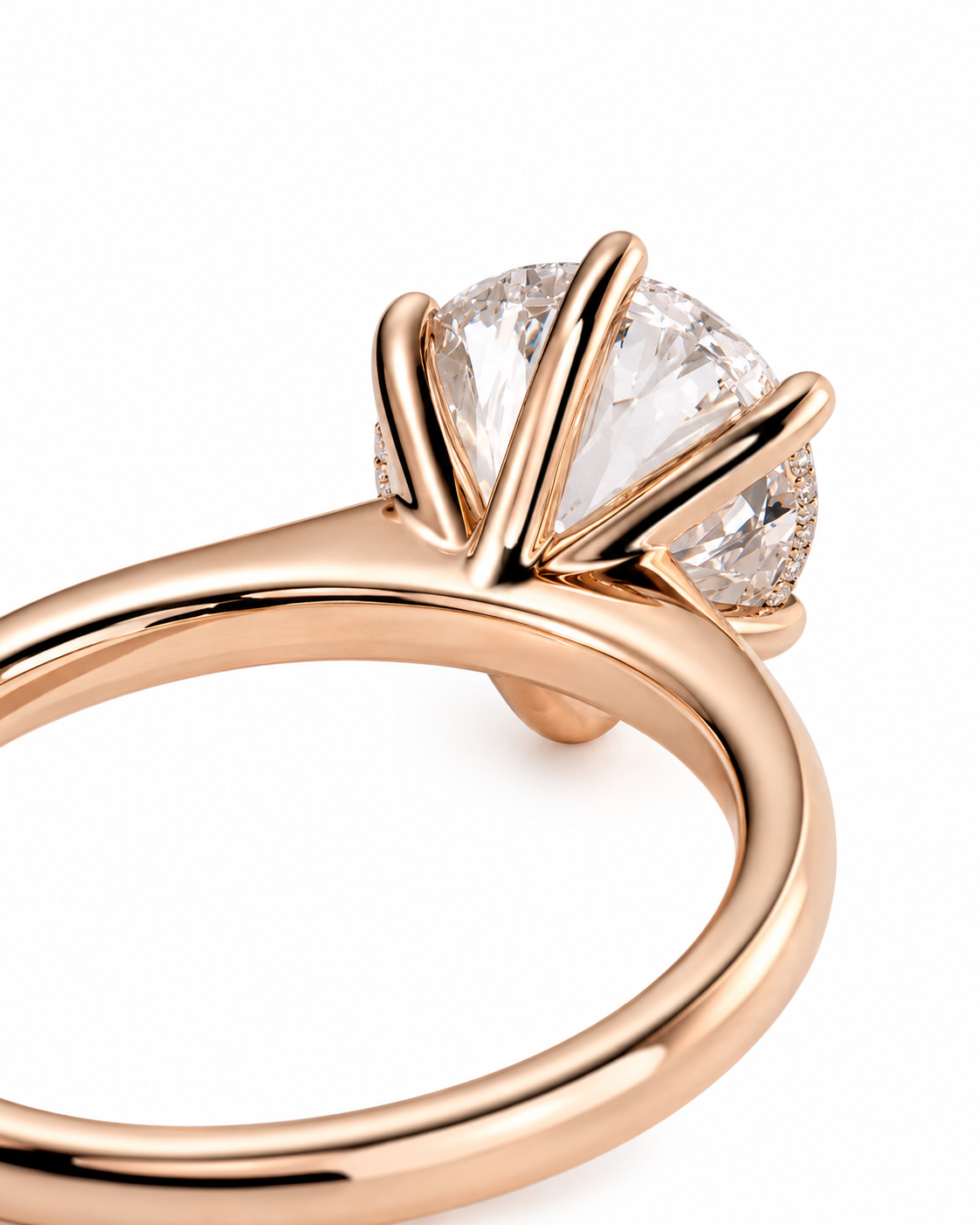 color_10K_RG, color_14K_RG &&A close-up shot of a rose gold ring with a brilliant round-cut clear gemstone in a prong setting, shown on a clean white background.