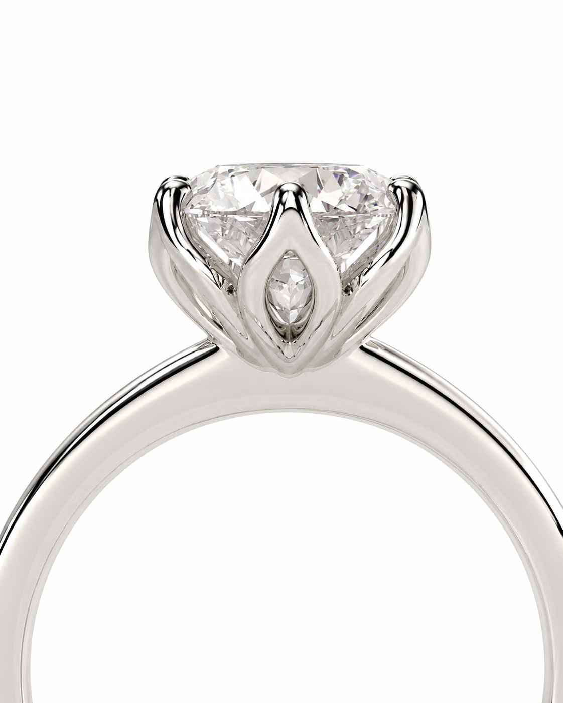 color_925_SIL,color_935_ARG,color_10K_WG, color_14K_WG &&A close-up shot of a silver-toned ring featuring a large round brilliant-cut diamond in a four-prong setting with a marquise-cut diamond accent in the center, set against a plain white background.