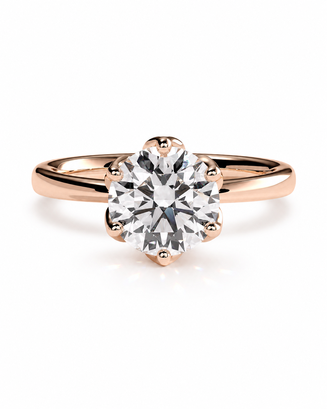 color_10K_RG, color_14K_RG &&A classic solitaire engagement ring featuring a round brilliant-cut diamond set in a rose gold four-prong setting, on a polished rose gold band, shot against a seamless white background.