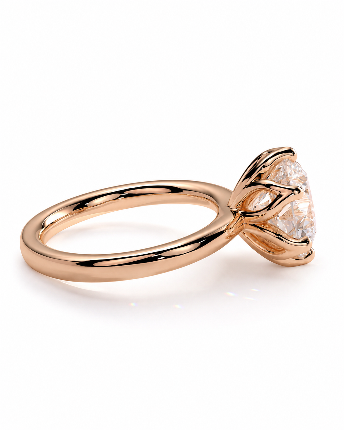 color_10K_RG, color_14K_RG &&A rose gold ring with a large clear gemstone in a prong setting, shown on a clean white background.