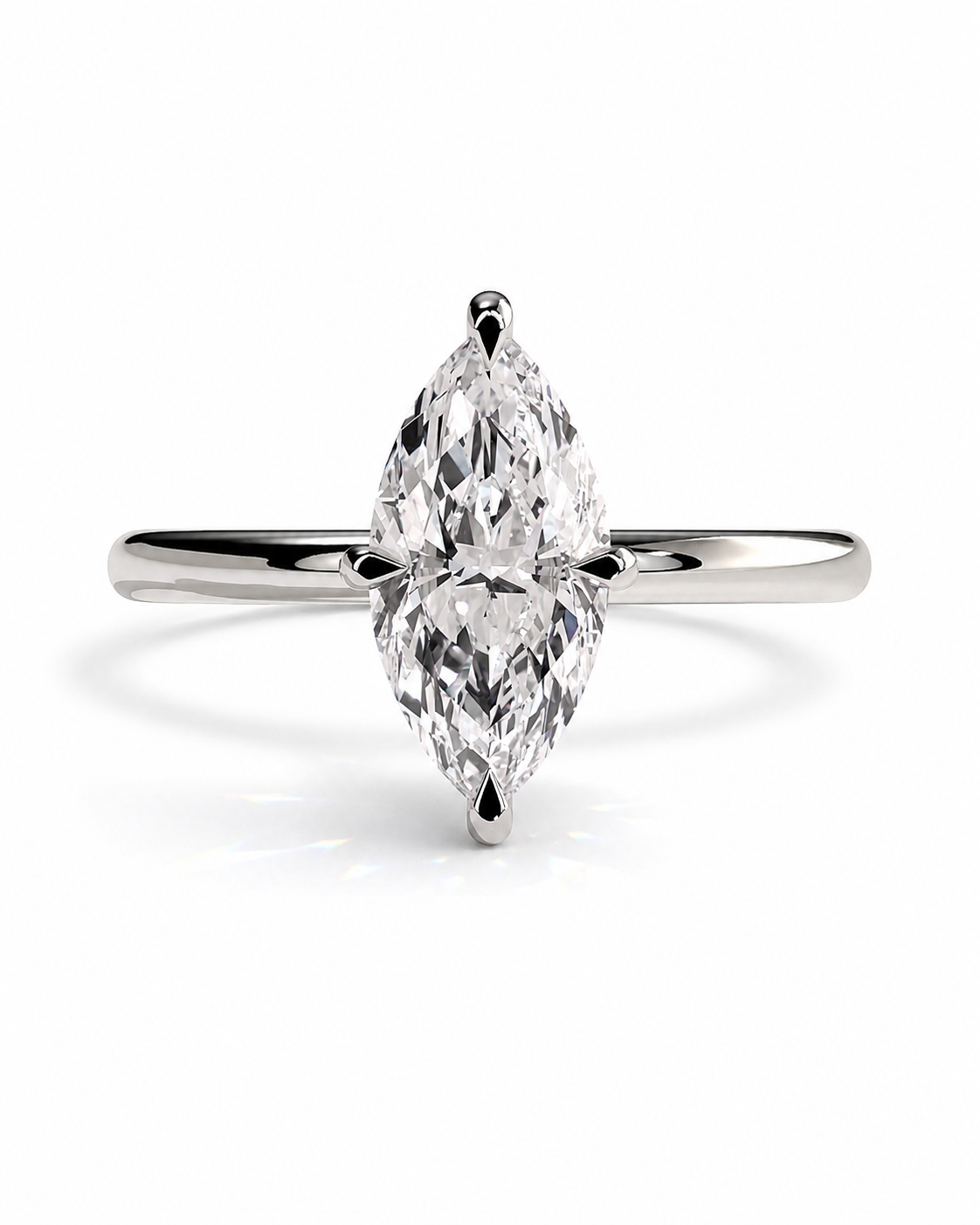 color_925_SIL,color_935_ARG,color_10K_WG, color_14K_WG &&A silver-tone ring featuring a marquise-cut clear gemstone in a four-prong setting, centered on a clean white background.