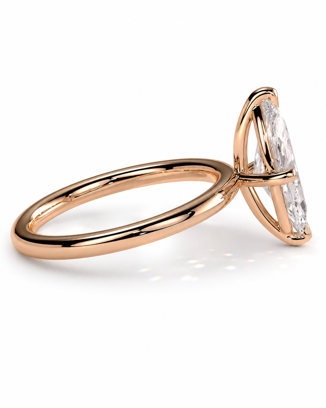 color_10K_RG, color_14K_RG &&A rose gold ring featuring a marquise-cut clear gemstone in a curved prong setting, shown on a clean white background.