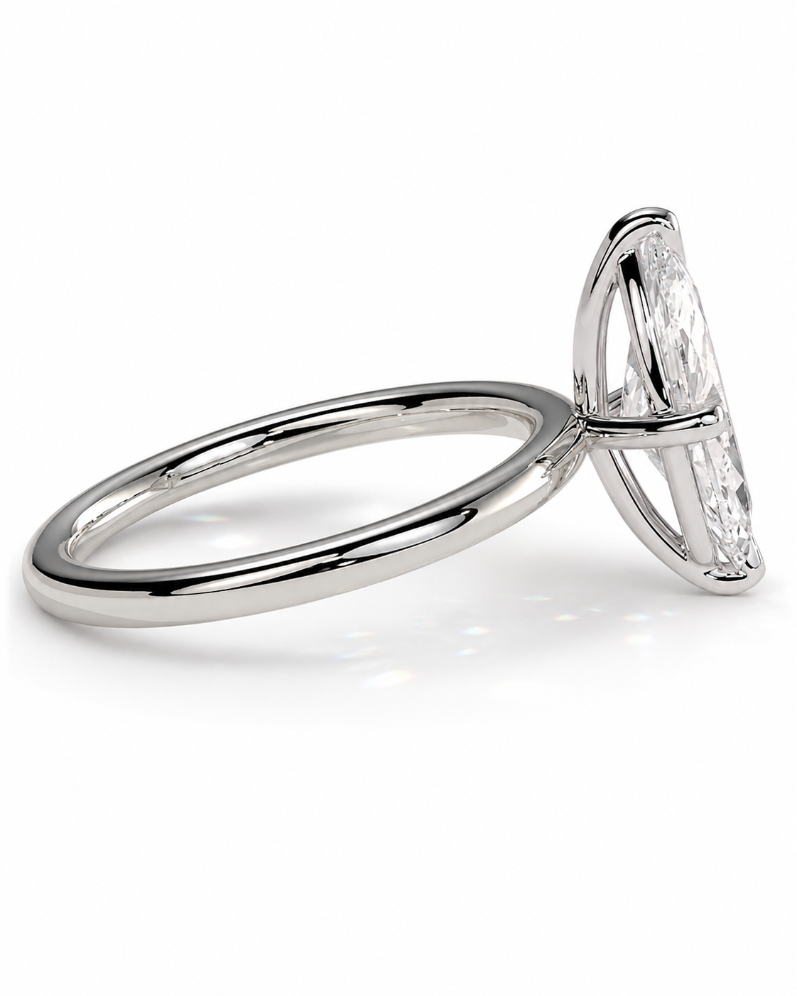 color_925_SIL,color_935_ARG,color_10K_WG, color_14K_WG &&A silver-toned diamond ring with a marquise-cut diamond in a prong setting, shown from a side angle on a clean white background.