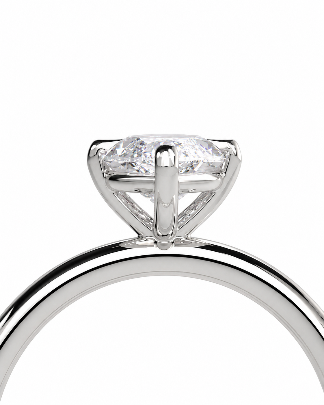 color_925_SIL,color_935_ARG,color_10K_WG, color_14K_WG &&A close-up studio shot of a silver-toned ring with a marquise-cut clear gemstone in a prong setting, shown against a plain white background.