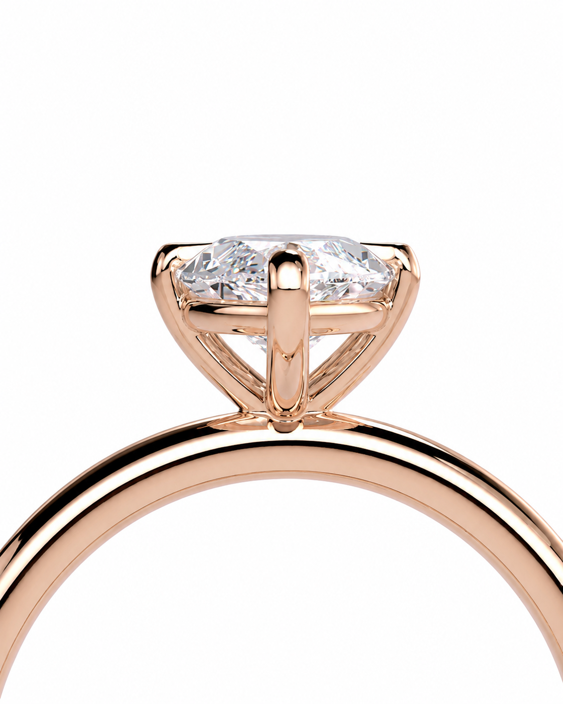 color_10K_RG, color_14K_RG &&Close-up of a rose gold engagement ring featuring a marquise-cut diamond in a four-prong setting, shown against a solid white background.