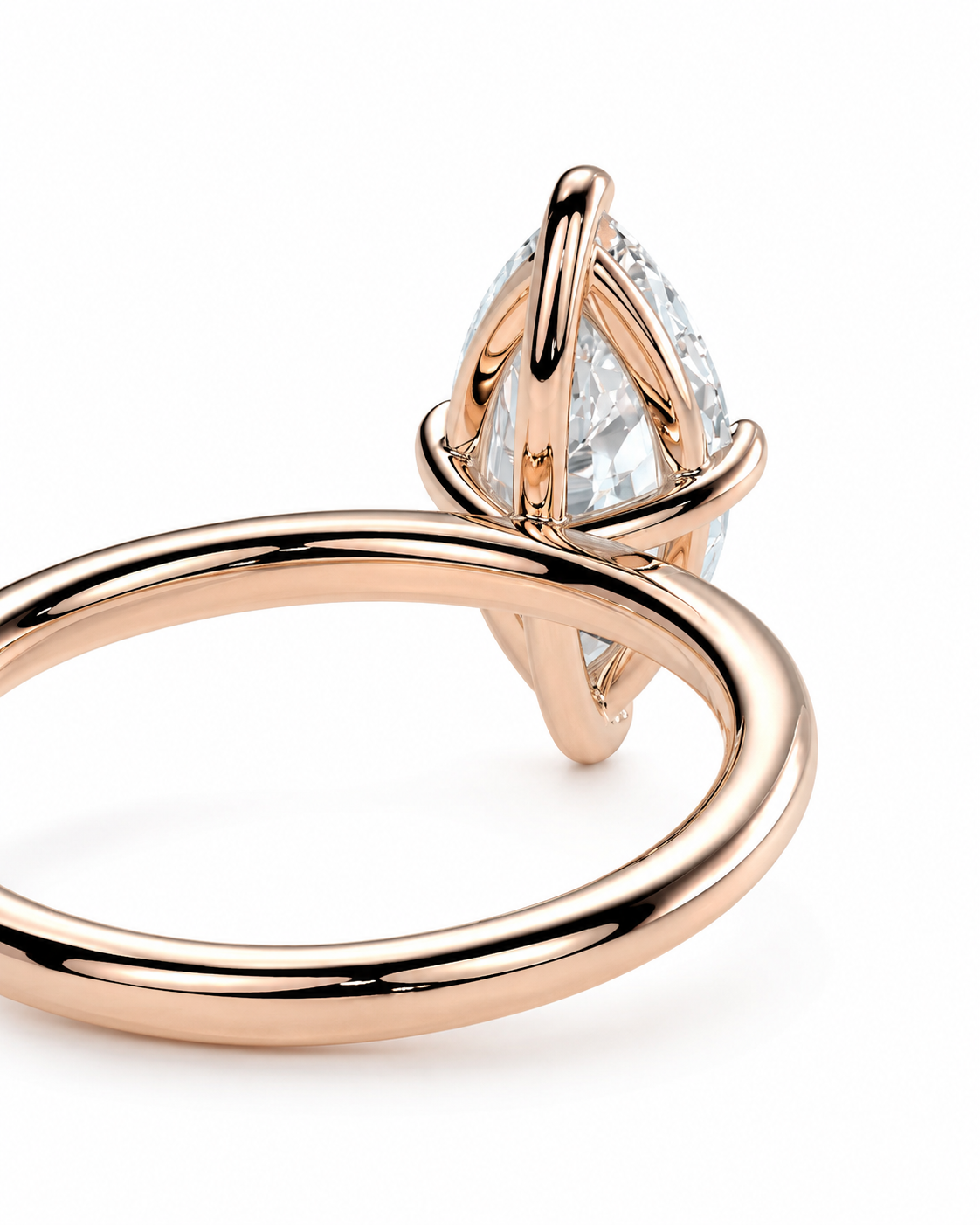 color_10K_RG, color_14K_RG &&A close-up of a rose gold ring featuring a marquise-cut clear gemstone in a wrap-style setting, shown on a clean white background.