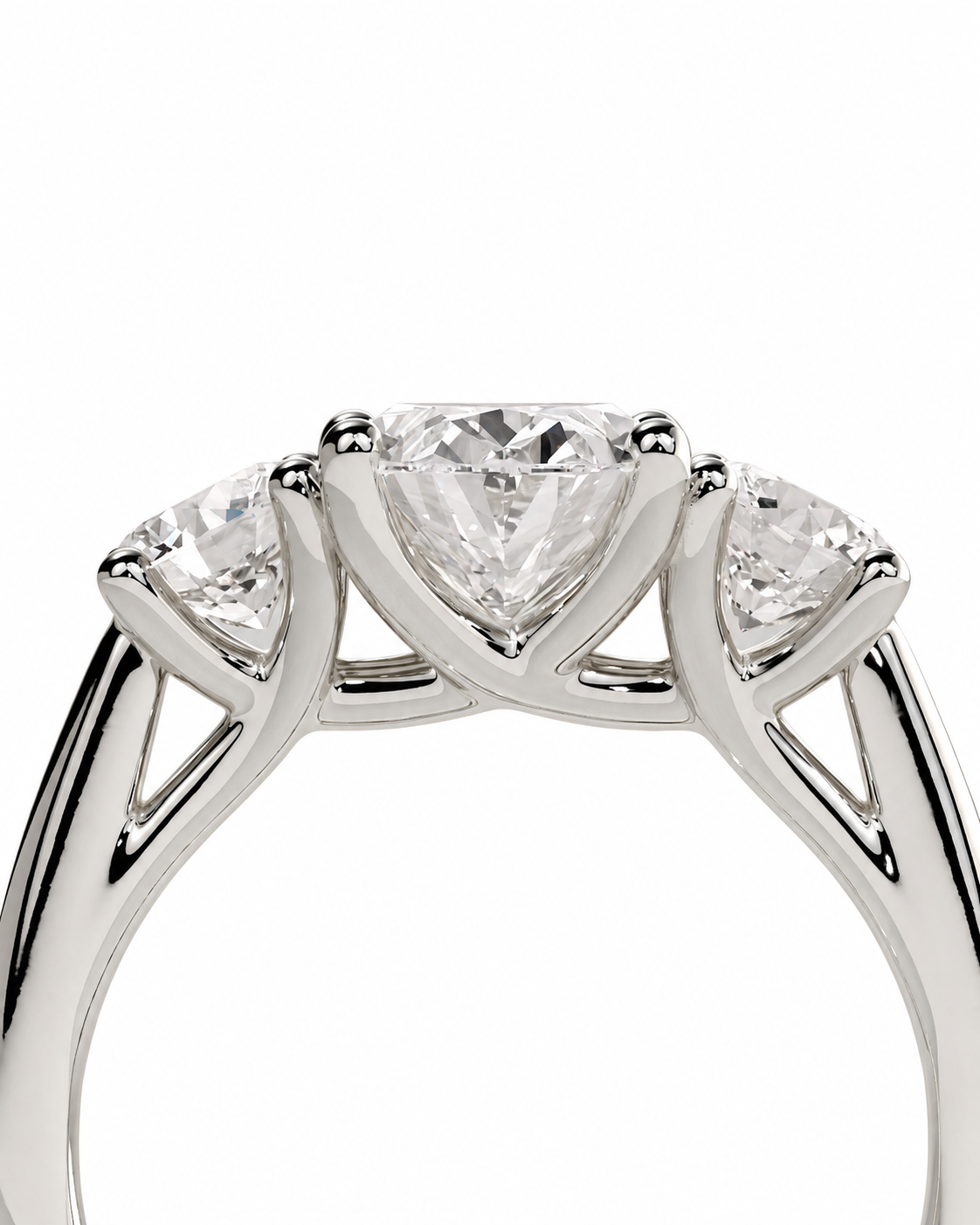 color_925_SIL,color_935_ARG,color_10K_WG, color_14K_WG &&A close-up of a silver-tone ring featuring a central pear-cut diamond flanked by two smaller round-cut diamonds, set against a plain white background.