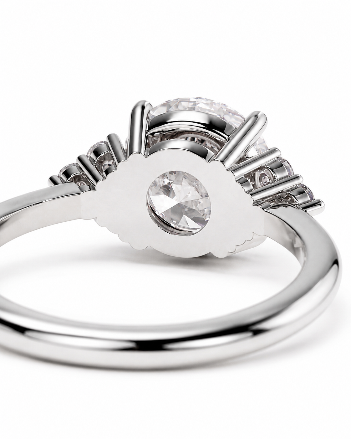 color_925_SIL,color_935_ARG,color_10K_WG, color_14K_WG &&A silver-toned ring with a large round clear center stone and smaller clear stones arranged in a fan-like cluster behind it, photographed on a clean white background.