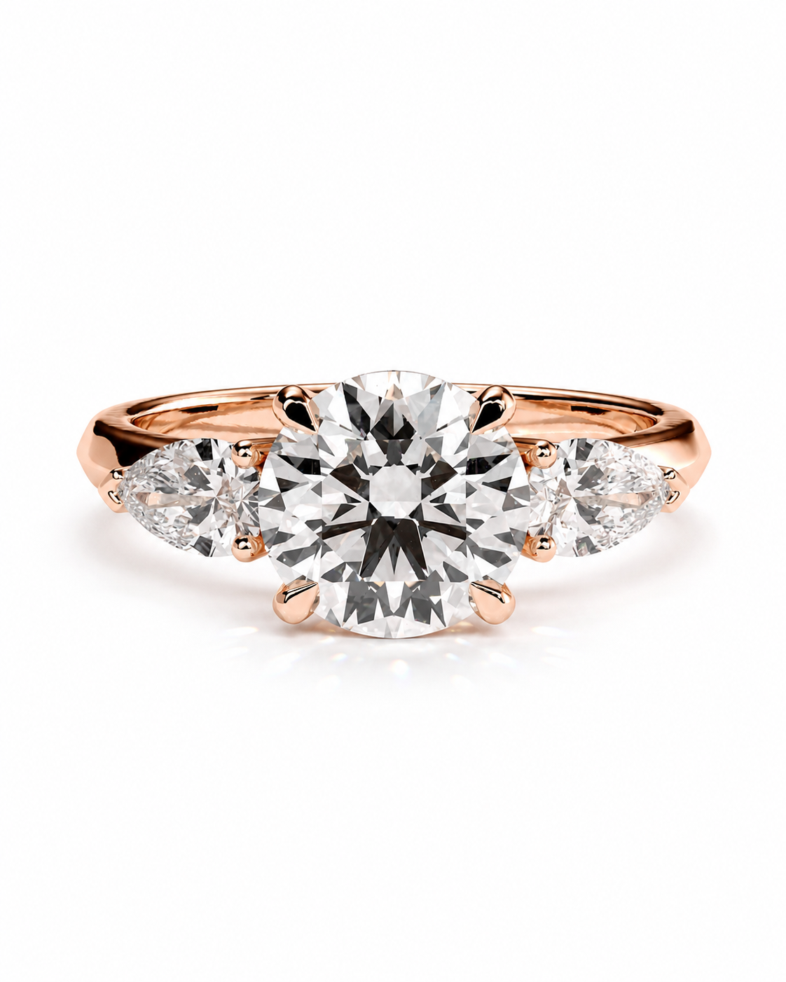 color_10K_RG, color_14K_RG &&A rose gold engagement ring featuring a round brilliant-cut center diamond flanked by two smaller round diamonds on a white background.