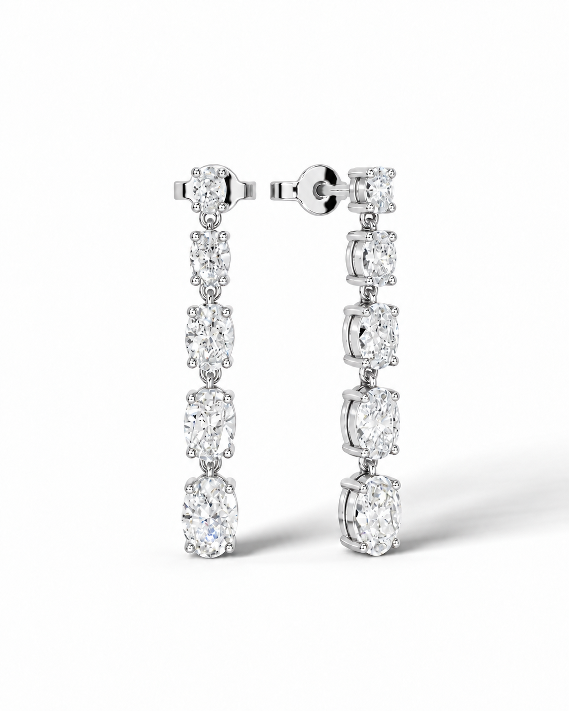 color_925_SIL,color_935_ARG,color_10K_WG, color_14K_WG &&A pair of silver-tone drop earrings featuring a vertical line of oval-cut clear gemstones, shown on a clean white background.