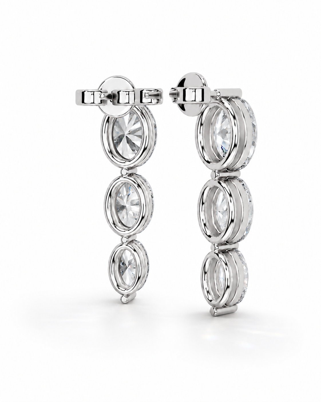 color_925_SIL,color_935_ARG,color_10K_WG, color_14K_WG &&A pair of silver-toned drop earrings featuring four vertically aligned oval clear gemstones in bezel settings, shown against a seamless white background.