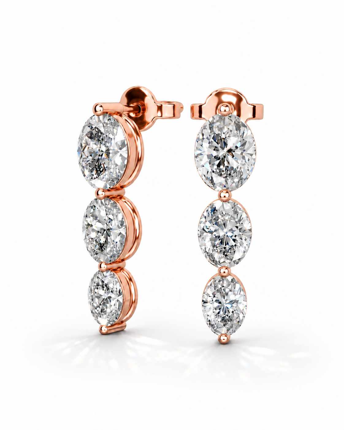 color_10K_RG, color_14K_RG &&A pair of rose gold drop earrings featuring three marquise-cut diamonds in a vertical setting, shown on a clean white background.