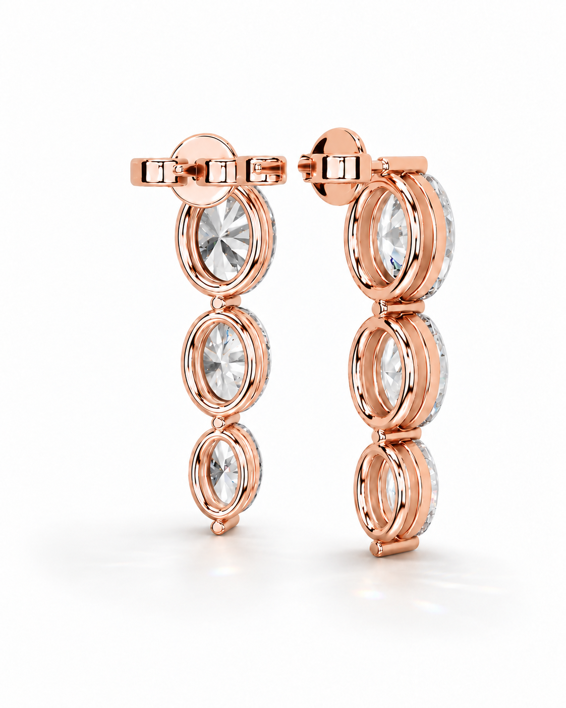 color_10K_RG, color_14K_RG &&A pair of rose gold hoop earrings with a vertical dangle design, featuring clear round-cut gemstones in bezel settings, shown on a clean white background.