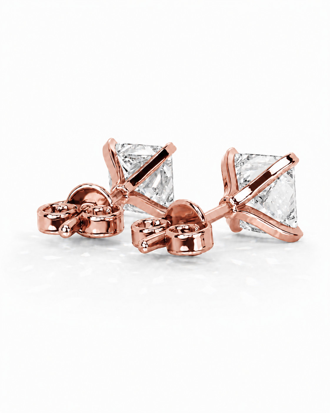 color_10K_RG, color_14K_RG &&Rose gold stud earrings with square clear gemstones, shown on a clean white background.