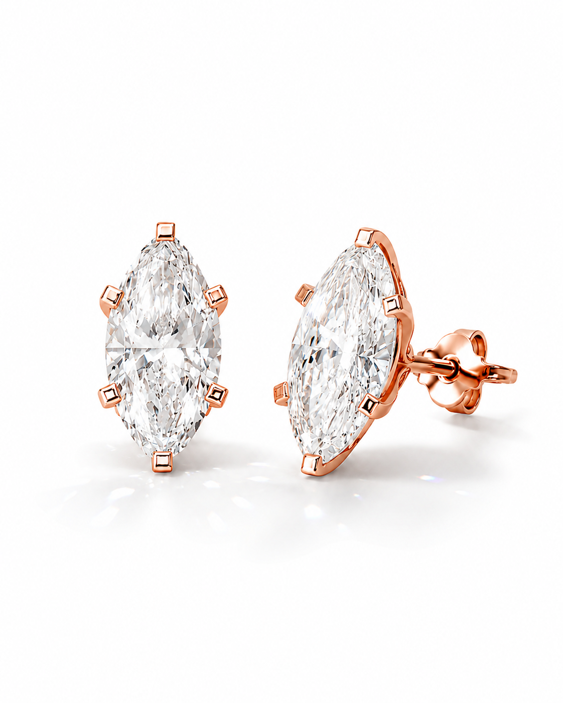 color_10K_RG, color_14K_RG &&A pair of rose gold stud earrings featuring marquise-cut clear gemstones in a prong setting, shown on a clean white background.