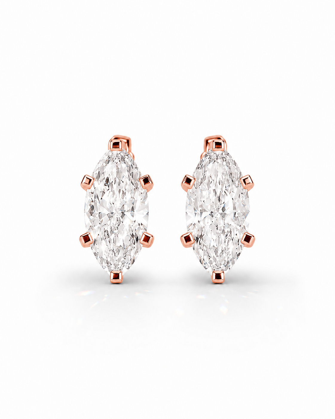 color_10K_RG, color_14K_RG &&A pair of rose gold stud earrings featuring marquise-cut clear gemstones in a prong setting, displayed on a clean white background.