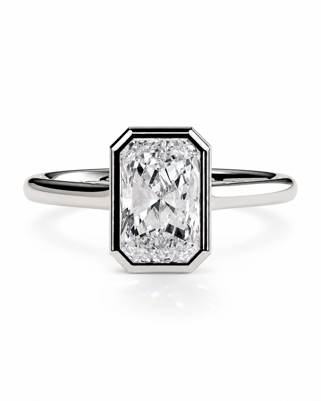 color_925_SIL,color_935_ARG,color_10K_WG, color_14K_WG &&An emerald-cut diamond ring in a silver-toned metal setting with a polished band, centered on a clean white background.