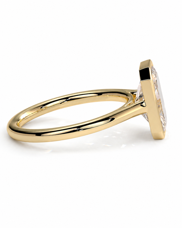 color_10K_YG, color_14K_YG &&A gold ring with a large clear rectangular gemstone in a prong setting, shown from a side angle on a white background.