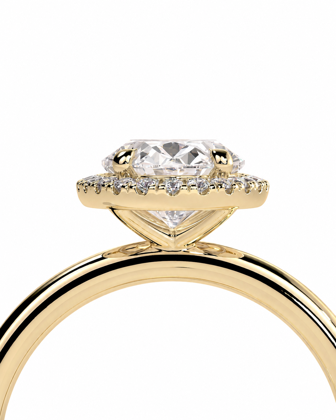 color_10K_YG, color_14K_YG &&
A close-up studio shot of a yellow gold ring with a large clear round-cut center stone and a halo of small clear stones, shown against a plain white background.