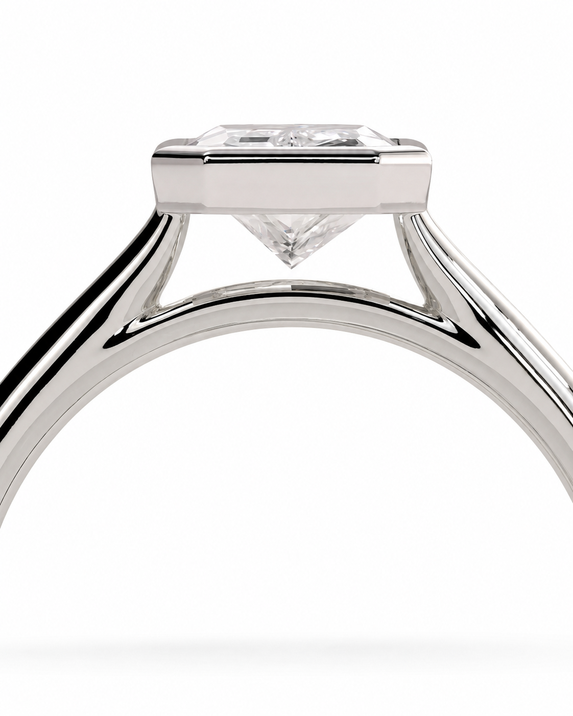 color_925_SIL,color_935_ARG,color_10K_WG, color_14K_WG &&Close-up of a silver-toned ring with a rectangular gemstone and a clear triangular accent below it, shown on a white background.